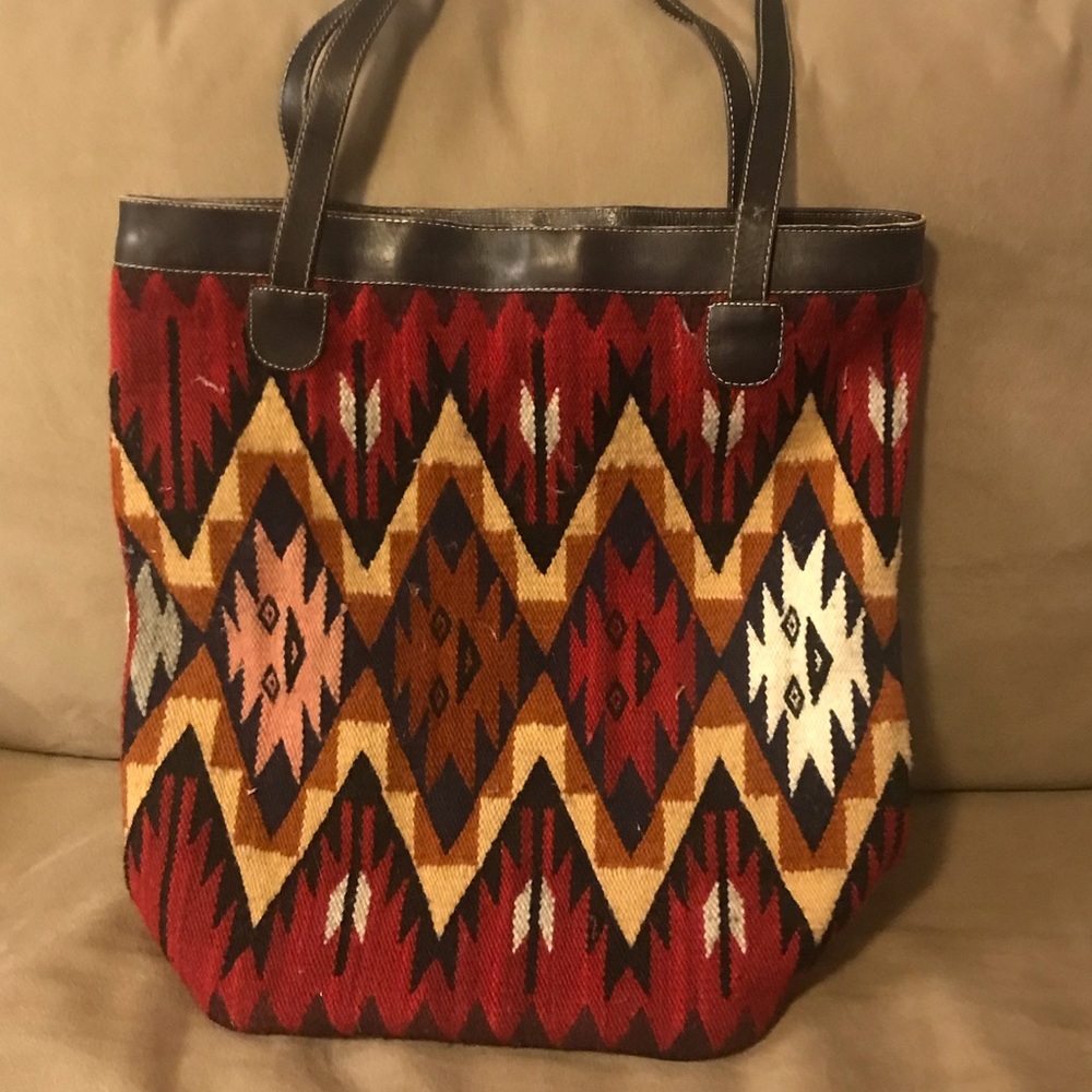 Woven wool and leather tote bag. Fully lined with inside zippered pocket.